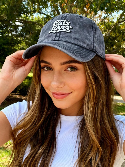 Cats Lover Vintage Embroidered Cap Dad Hat Grey Words worn by a young woman outdoors with sunlit background.