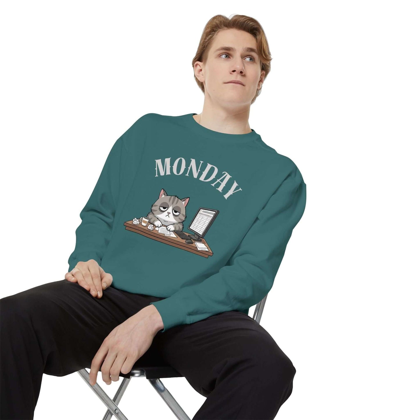 Monday Face Cat Stares Blankly Unisex Crewneck Sweatshirt worn by a man, featuring a grumpy cat under a 'MONDAY' banner.