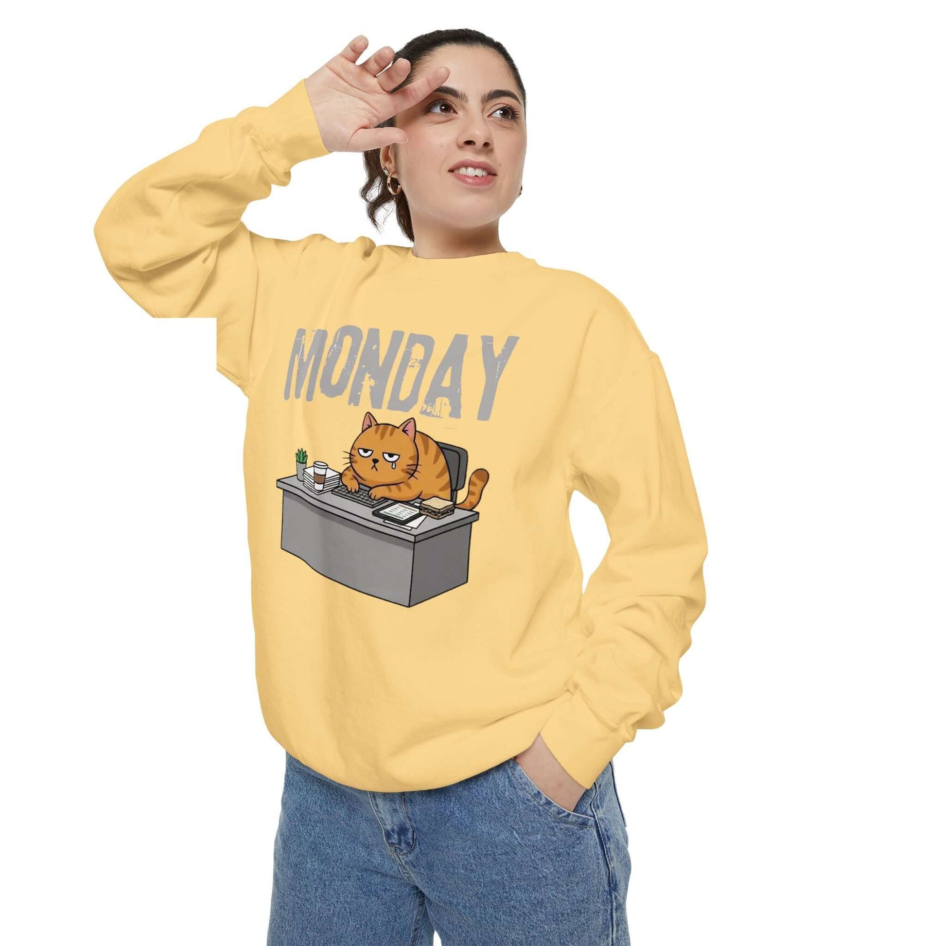 Monday Face Cat Stares Blankly Unisex Crewneck Sweatshirt worn by a person, featuring a grumpy cat under a 'MONDAY' banner.