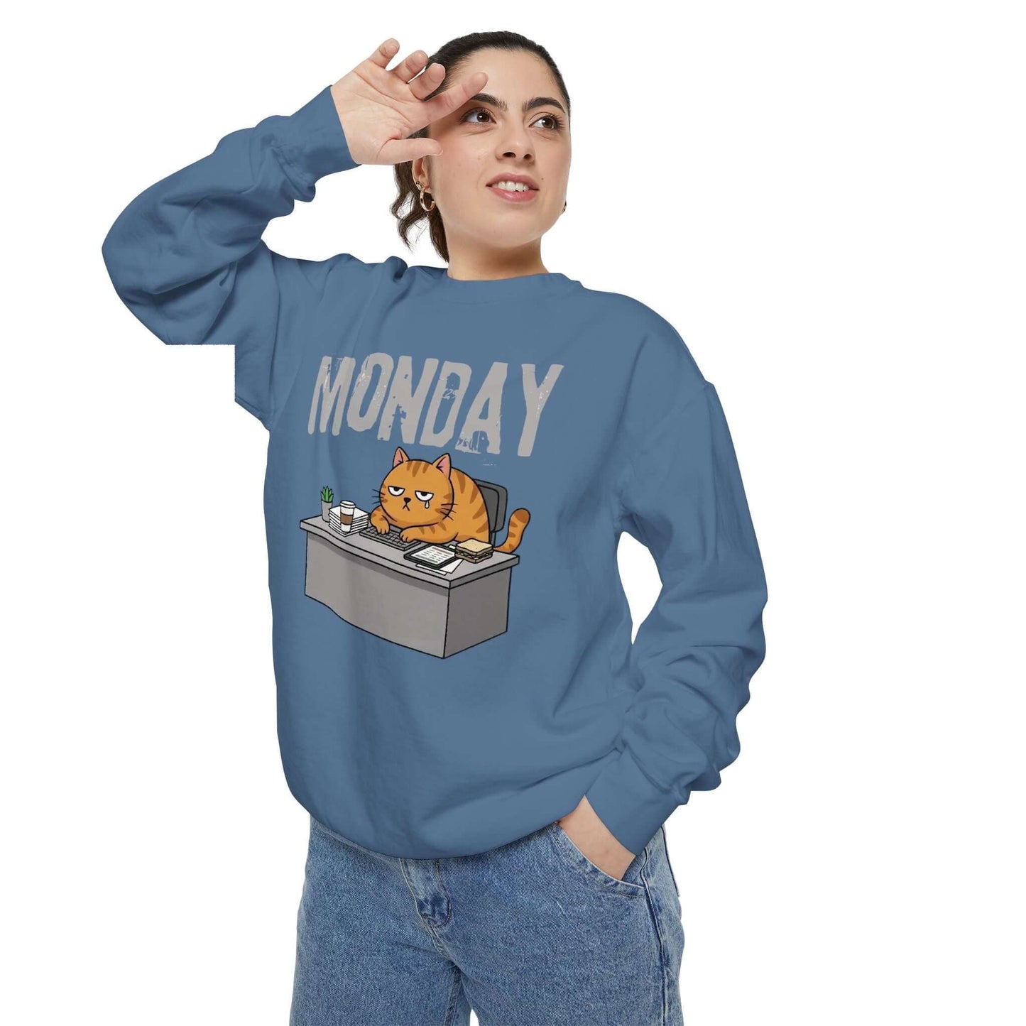 Monday Face Cat Stares Blankly Unisex Crewneck Sweatshirt featuring a cat at a desk with the word MONDAY.