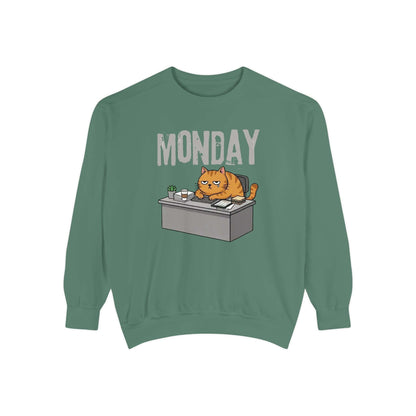 Monday Face Cat Stares Blankly Unisex Crewneck Sweatshirt in green with grumpy cat graphic and 'MONDAY' text.
