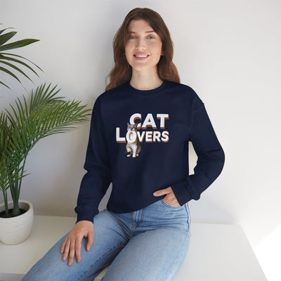 A young woman wearing a cat lovers cute kitten sweatshirt, featuring adorable feline graphics, posing indoors.