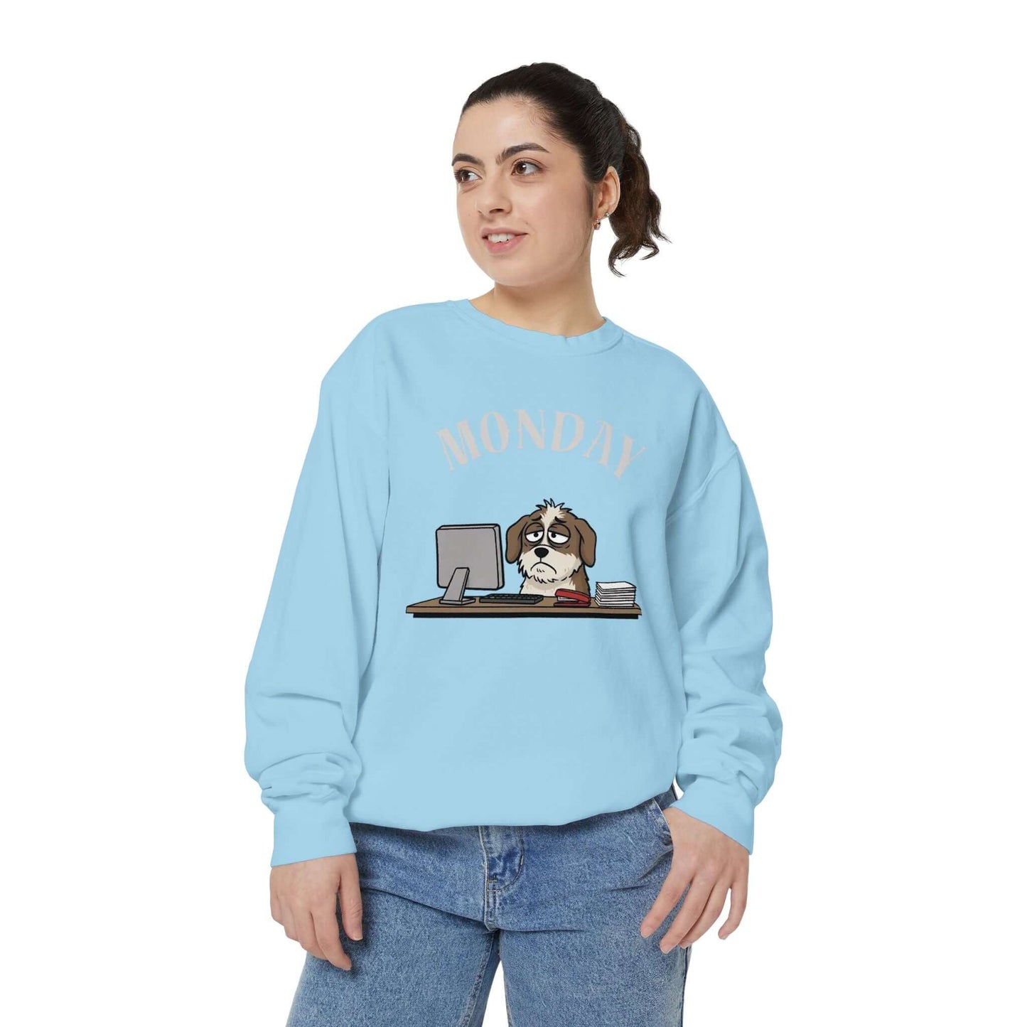 Monday Face Dog Stares Blankly Unisex Crewneck Sweatshirt in blue featuring a grumpy dog under a 'MONDAY' banner.
