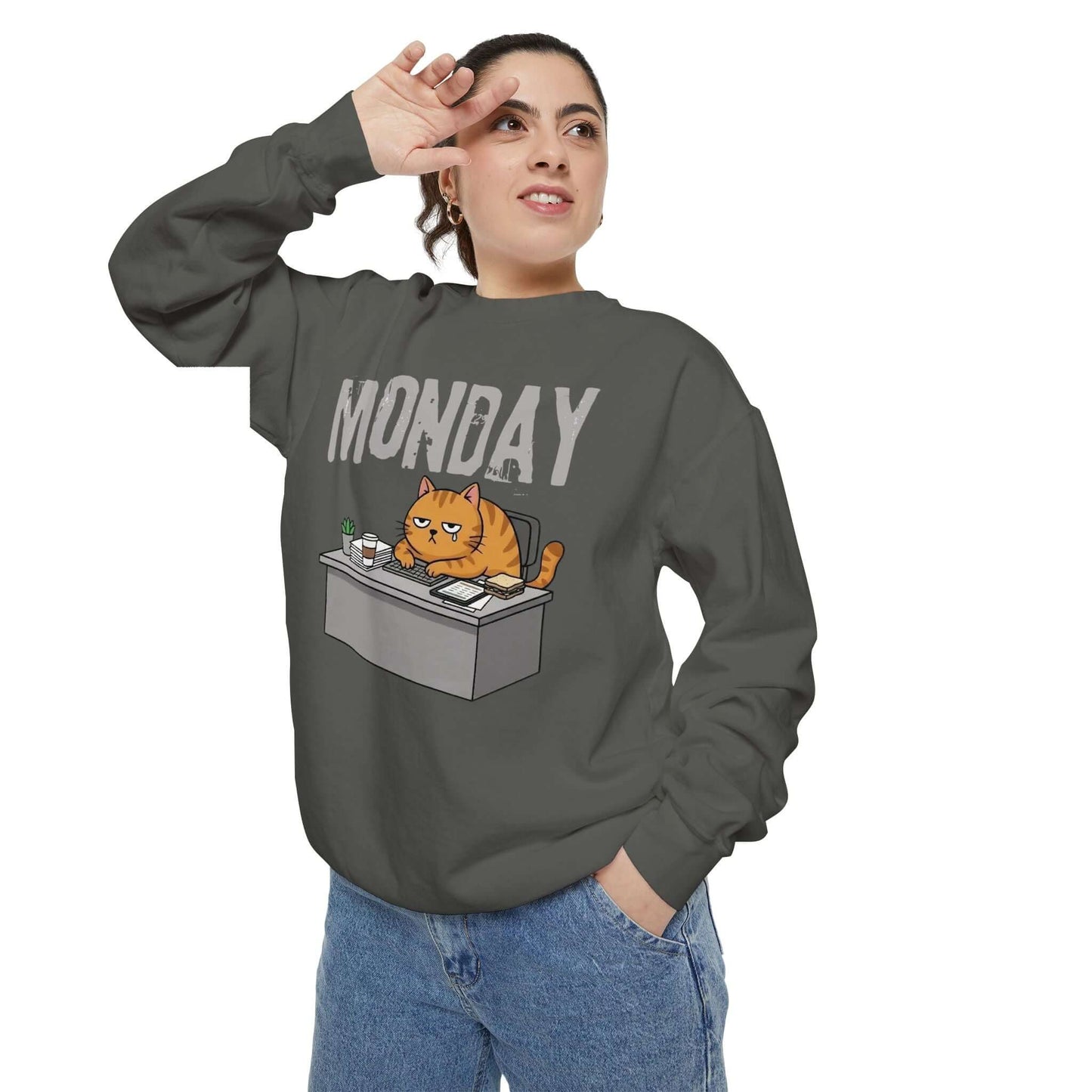 Monday Face Cat Stares Blankly Unisex Crewneck Sweatshirt featuring a grumpy cat at a desk.