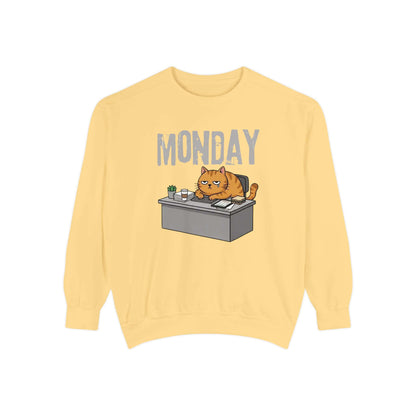 Monday Face Cat Stares Blankly Unisex Crewneck Sweatshirt featuring a cat at a desk with a "MONDAY" banner.