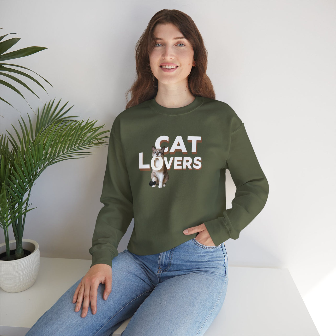 cat lovers cute kitten sweatshirt worn by a woman, featuring a cute kitten graphic on an olive green background.
