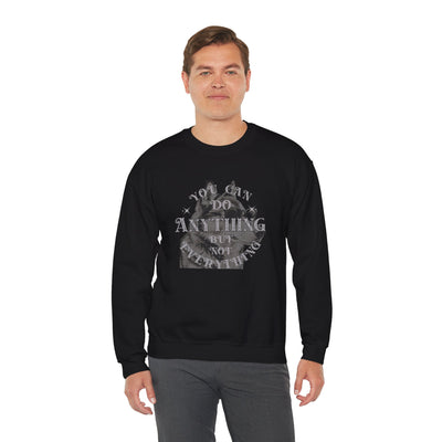 Cool dog graphic sweatshirt featuring motivational quote on a man wearing a black crewneck.