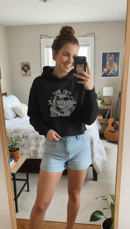Woman smiling in a Cool Dog Graphic Motivational Women Cropped Hoodie, paired with denim shorts, indoors.