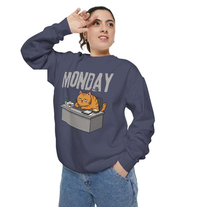Monday Face Cat Stares Blankly Unisex Crewneck Sweatshirt featuring a cat at a desk with a 'MONDAY' banner.