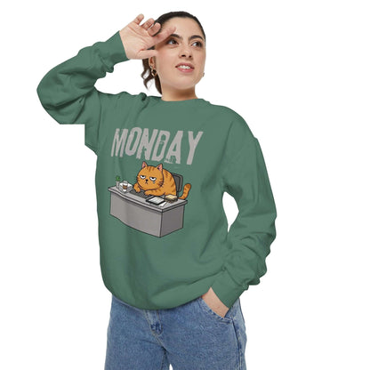 Monday Face Cat Stares Blankly Unisex Crewneck Sweatshirt featuring a grumpy cat with a ‘MONDAY’ banner.