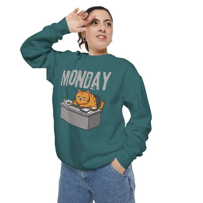 Monday Face Cat Stares Blankly Unisex Crewneck Sweatshirt worn by a person, featuring a grumpy cat graphic.