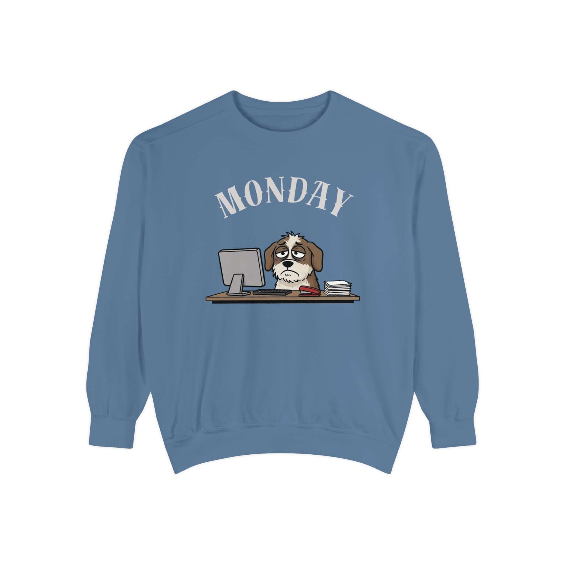 Monday Face Dog Stares Blankly Unisex Crewneck Sweatshirt on a blue background with a cartoon dog at a desk.