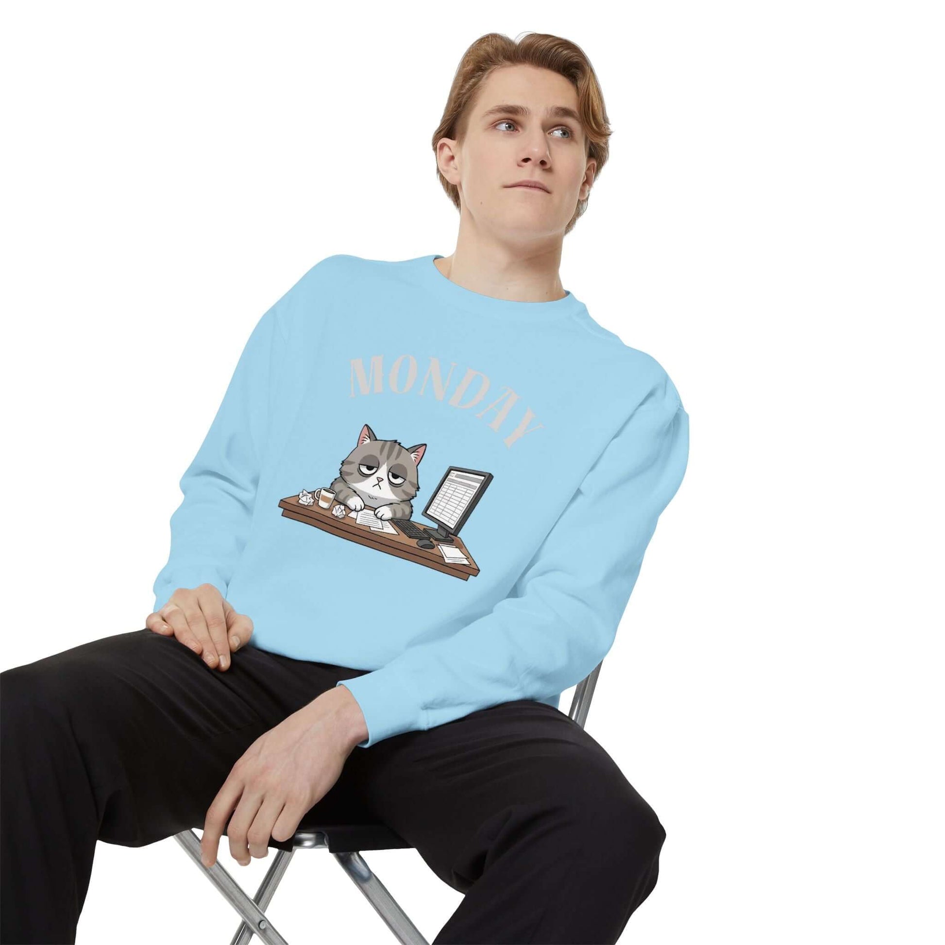 Monday Face Cat Stares Blankly Unisex Crewneck Sweatshirt in blue with cat graphic and 'MONDAY' text.