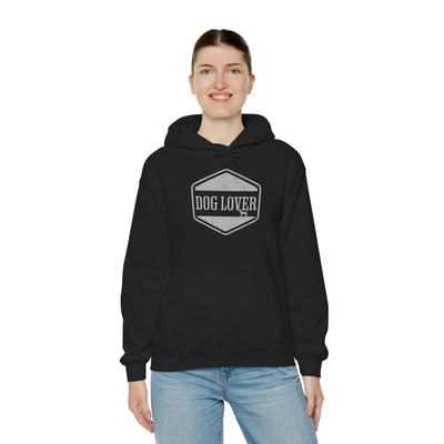 Dog Lover plus Slogan on Back Unisex Pullover Hoodie displayed on model, featuring vintage badge design.