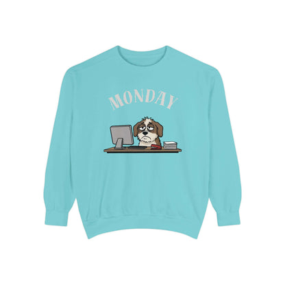 Monday Face Dog Stares Blankly Unisex Crewneck Sweatshirt with a cartoon dog at a desk under a MONDAY banner.
